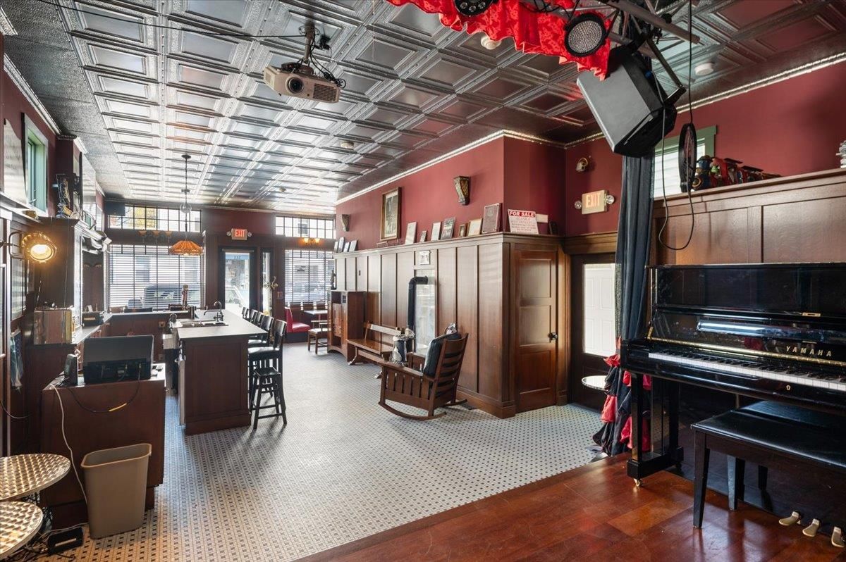 Dining room, Interior, Pendant Lights, Piano, Wood Texture Flooring