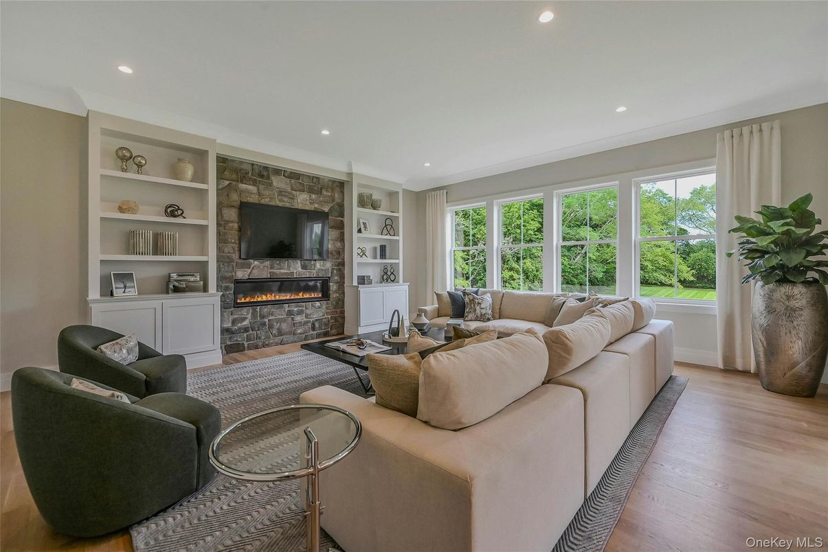 Fireplace, Interior, Living room, Recessed Lighting, Stone Walls, Wood Texture Flooring