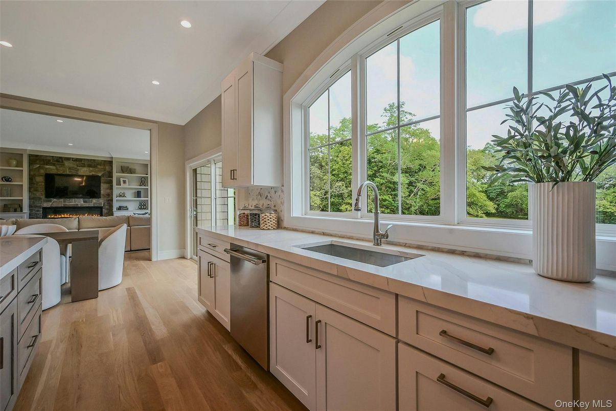 Fireplace, Interior, Kitchen, Recessed Lighting, Stainless Steel Appliances, Wood Texture Flooring