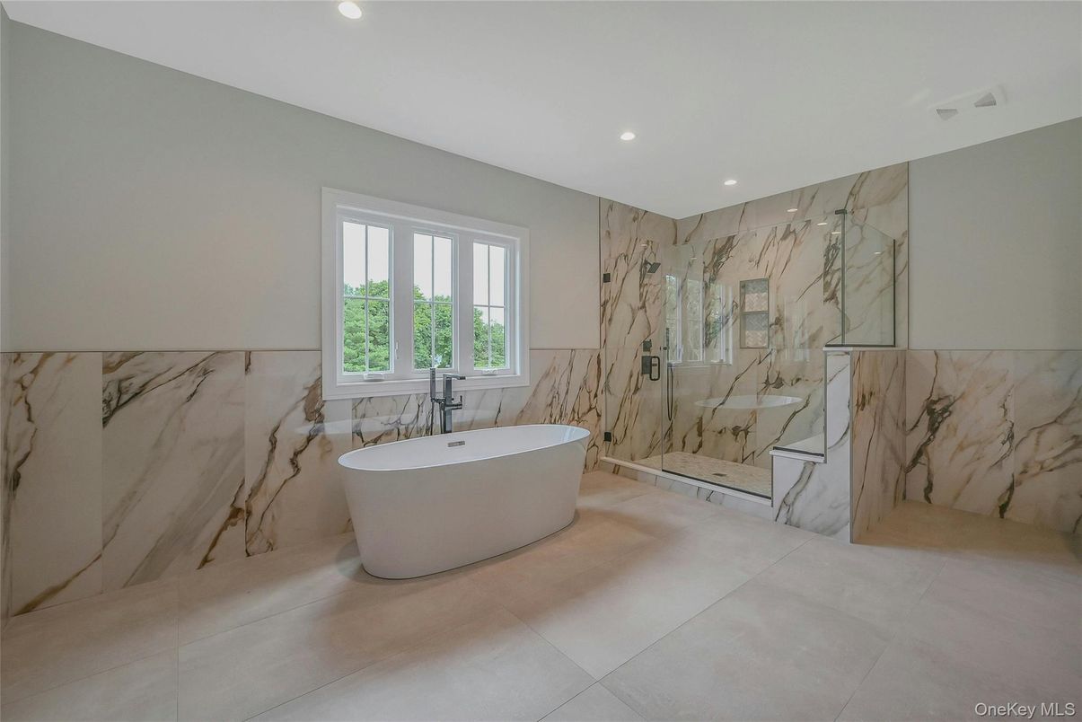 Bathroom, Free Standing Baths, Glass Shower, Interior, Marble Walls, Recessed Lighting