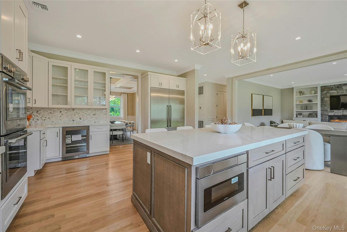 Dining room, Fireplace, Interior, Kitchen, Living room, Pendant Lights, Recessed Lighting, Stainless Steel Appliances, Wood Texture Flooring