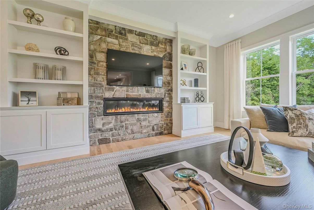 Fireplace, Interior, Living room, Recessed Lighting, Stone Walls, Wood Texture Flooring