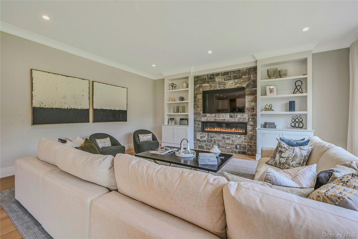 Fireplace, Interior, Living room, Recessed Lighting, Stone Walls, Wood Texture Flooring