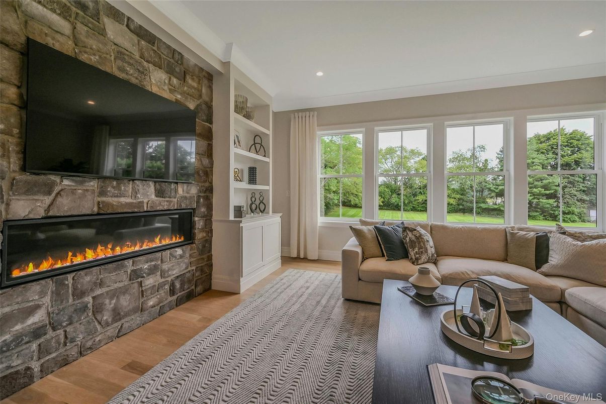 Fireplace, Interior, Living room, Recessed Lighting, Stone Walls, Wood Texture Flooring