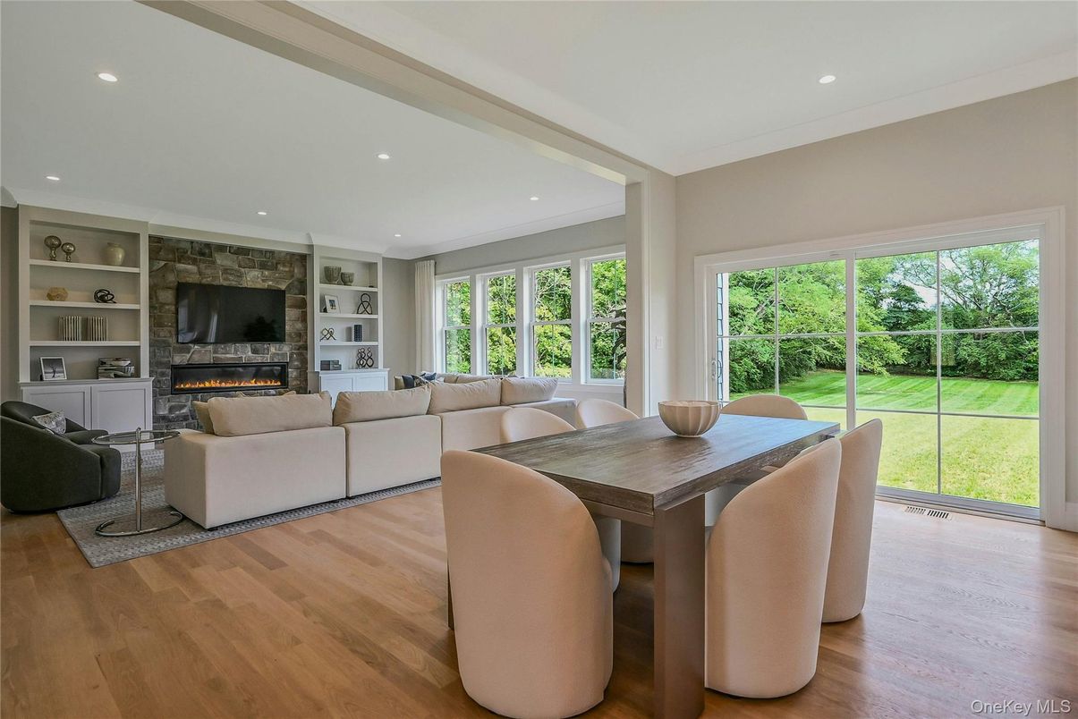 Dining room, Fireplace, Interior, Living room, Recessed Lighting, Wood Texture Flooring