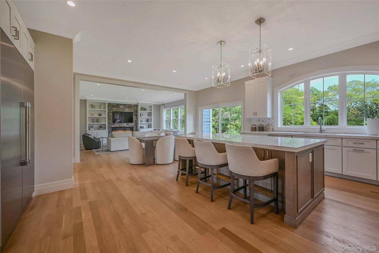 Chandelier, Fireplace, Interior, Kitchen, Living room, Pendant Lights, Recessed Lighting, Wood Texture Flooring