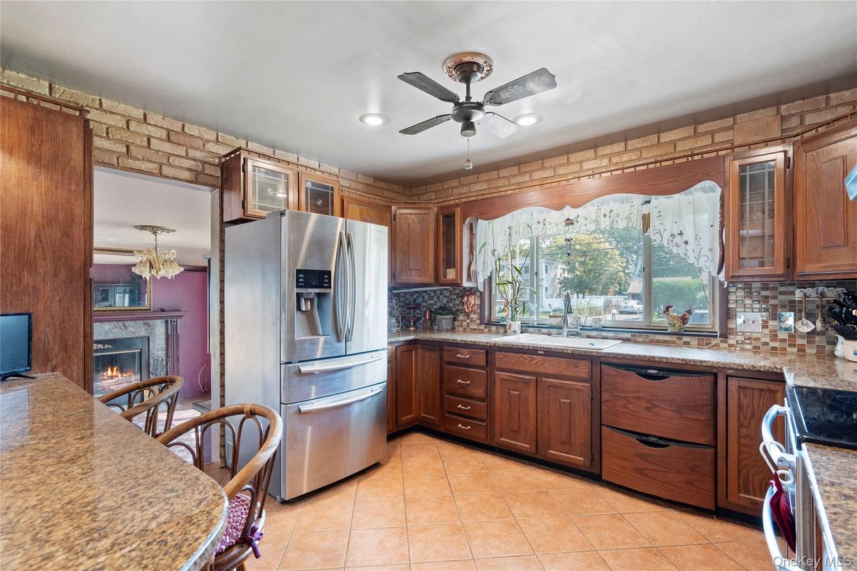 Fireplace, Interior, Kitchen, Recessed Lighting, Stainless Steel Appliances, Stone Walls