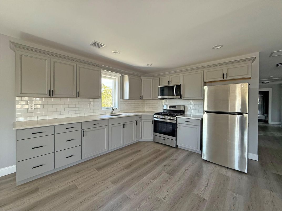 Interior, Kitchen, Recessed Lighting, Stainless Steel Appliances, Wood Texture Flooring