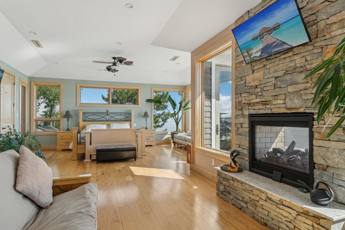Bedroom, Fireplace, Interior, Recessed Lighting, Stone Walls, Wood Texture Flooring