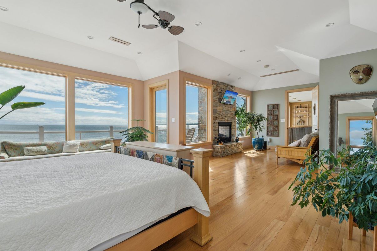 Bedroom, Fireplace, Interior, Recessed Lighting, Water, Wood Texture Flooring
