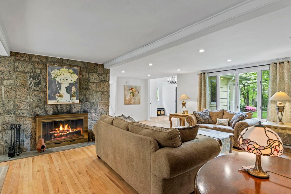 Fireplace, Interior, Living room, Recessed Lighting, Stone Walls, Wood Texture Flooring