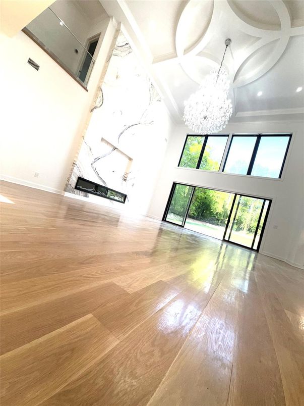 Chandelier, Fireplace, Interior, Marble Walls, Recessed Lighting, Wood Texture Flooring
