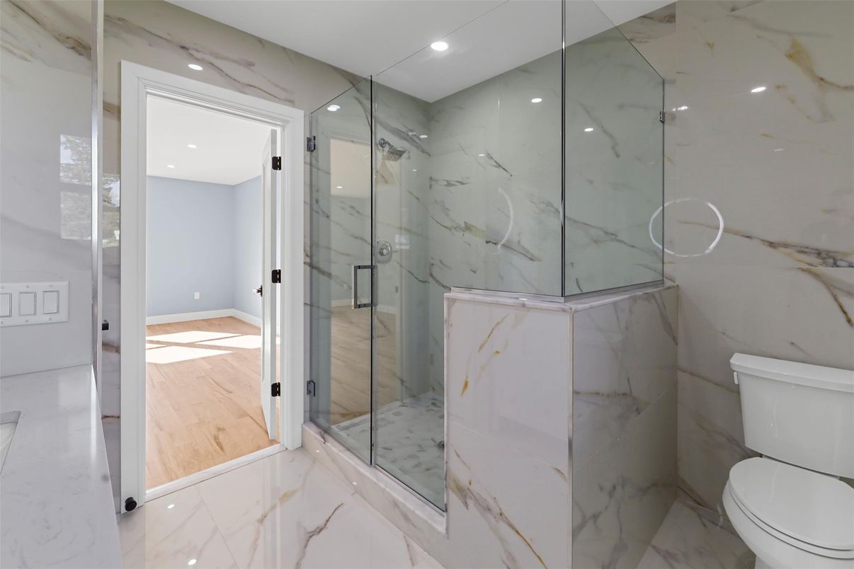 Bathroom, Glass Shower, Interior, Marble, Marble Walls, Recessed Lighting, Wood Texture Flooring