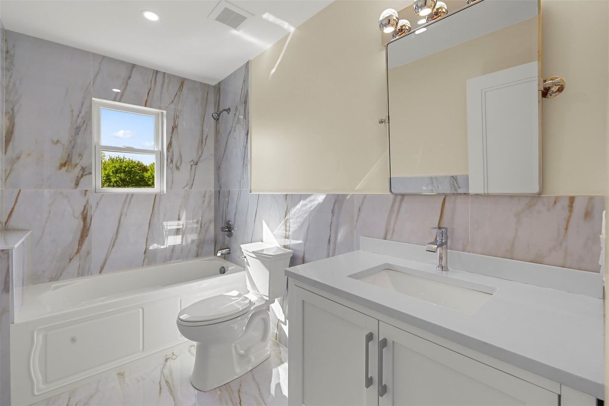 Bathroom, Dual Sink Vanities, Interior, Marble, Marble Walls, Recessed Lighting