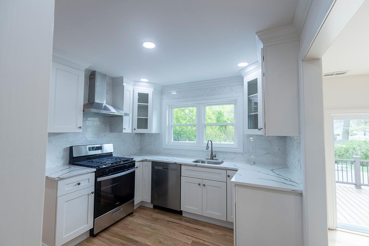 Interior, Kitchen, Marble Walls, Recessed Lighting, Stainless Steel Appliances, Wood Texture Flooring