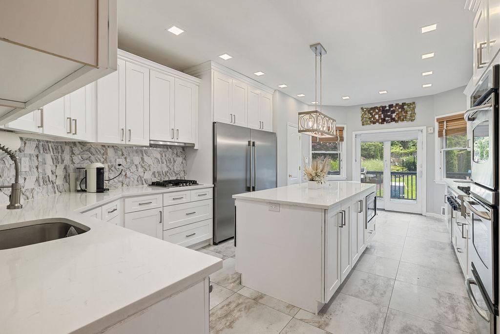 Interior, Kitchen, Marble Walls, Pendant Lights, Recessed Lighting, Stainless Steel Appliances