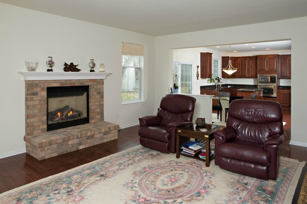 Fireplace, Interior, Kitchen, Living room, Pendant Lights, Recessed Lighting, Stainless Steel Appliances, Wood Texture Flooring