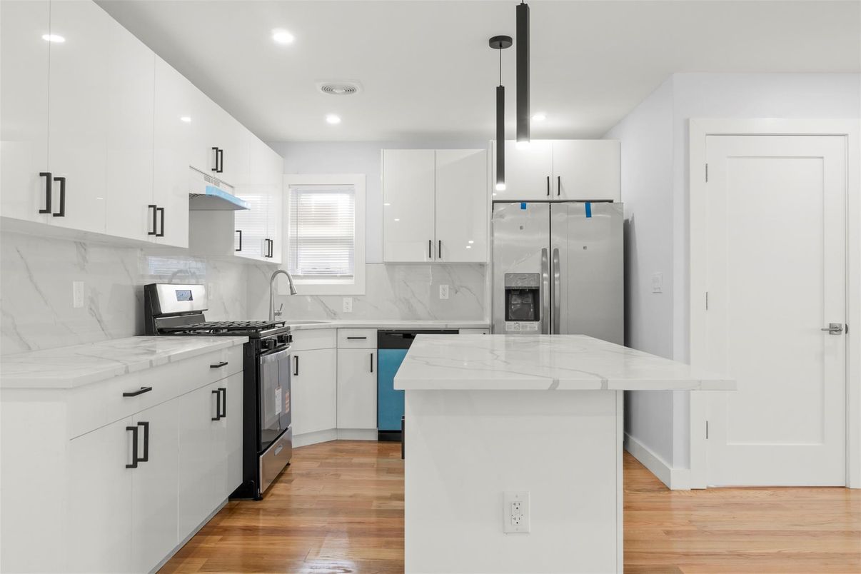 Interior, Kitchen, Marble Walls, Pendant Lights, Recessed Lighting, Stainless Steel Appliances, Wood Texture Flooring