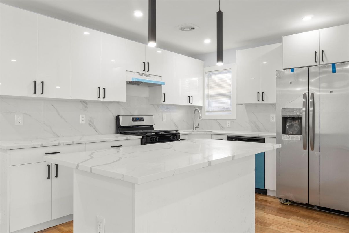 Interior, Kitchen, Marble Walls, Recessed Lighting, Stainless Steel Appliances, Wood Texture Flooring