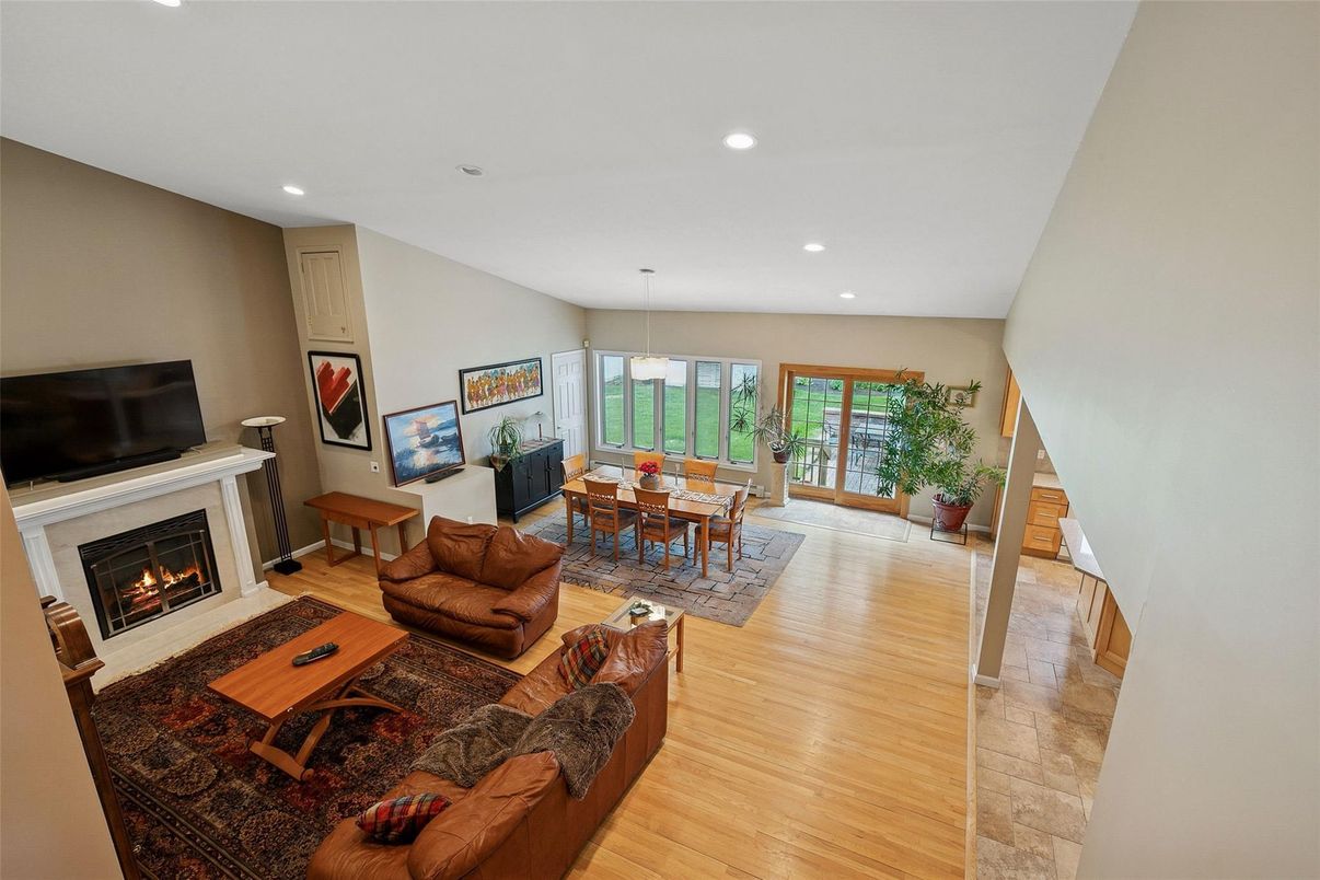 Dining room, Fireplace, Interior, Living room, Pendant Lights, Recessed Lighting, Wood Texture Flooring