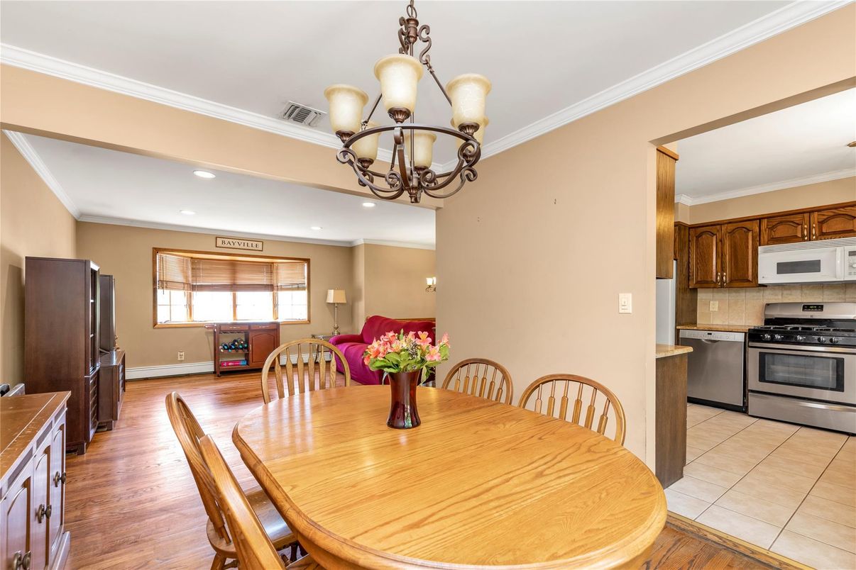 Chandelier, Dining room, Interior, Kitchen, Recessed Lighting, Stainless Steel Appliances, Wood Texture Flooring