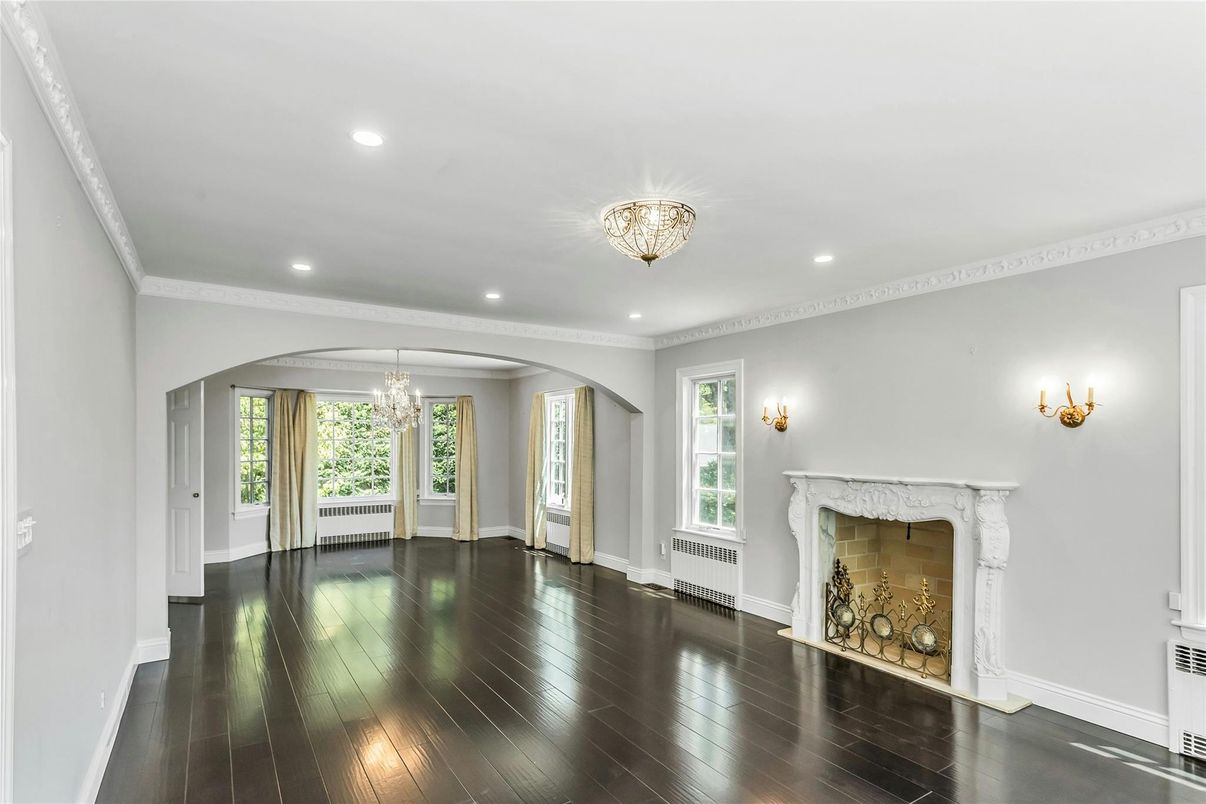 Chandelier, Empty room, Fireplace, Interior, Recessed Lighting, Wood Texture Flooring