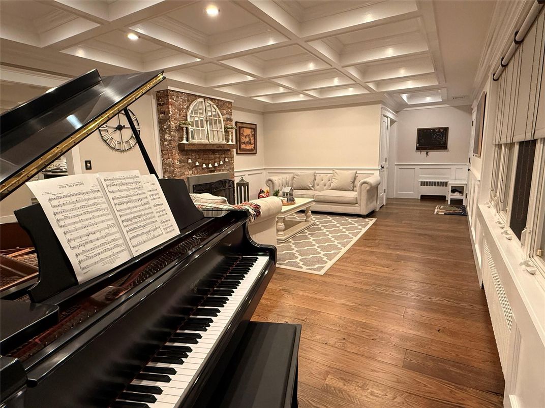 Fireplace, Interior, Living room, Piano, Recessed Lighting, Wood Texture Flooring