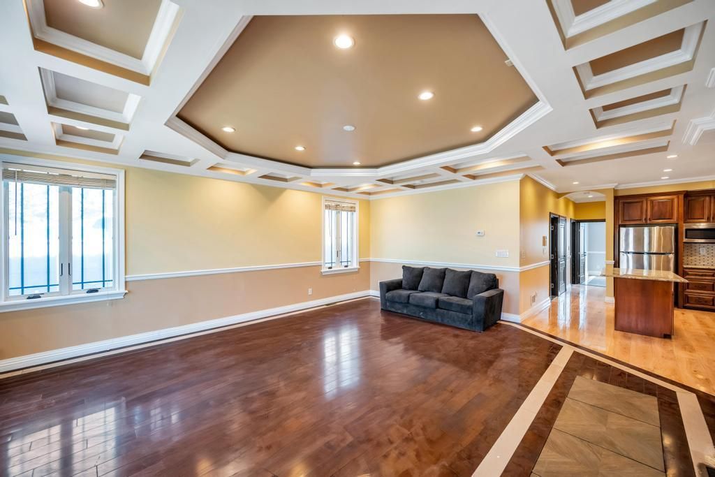 Empty room, Interior, Kitchen, Recessed Lighting, Stainless Steel Appliances, Wood Texture Flooring