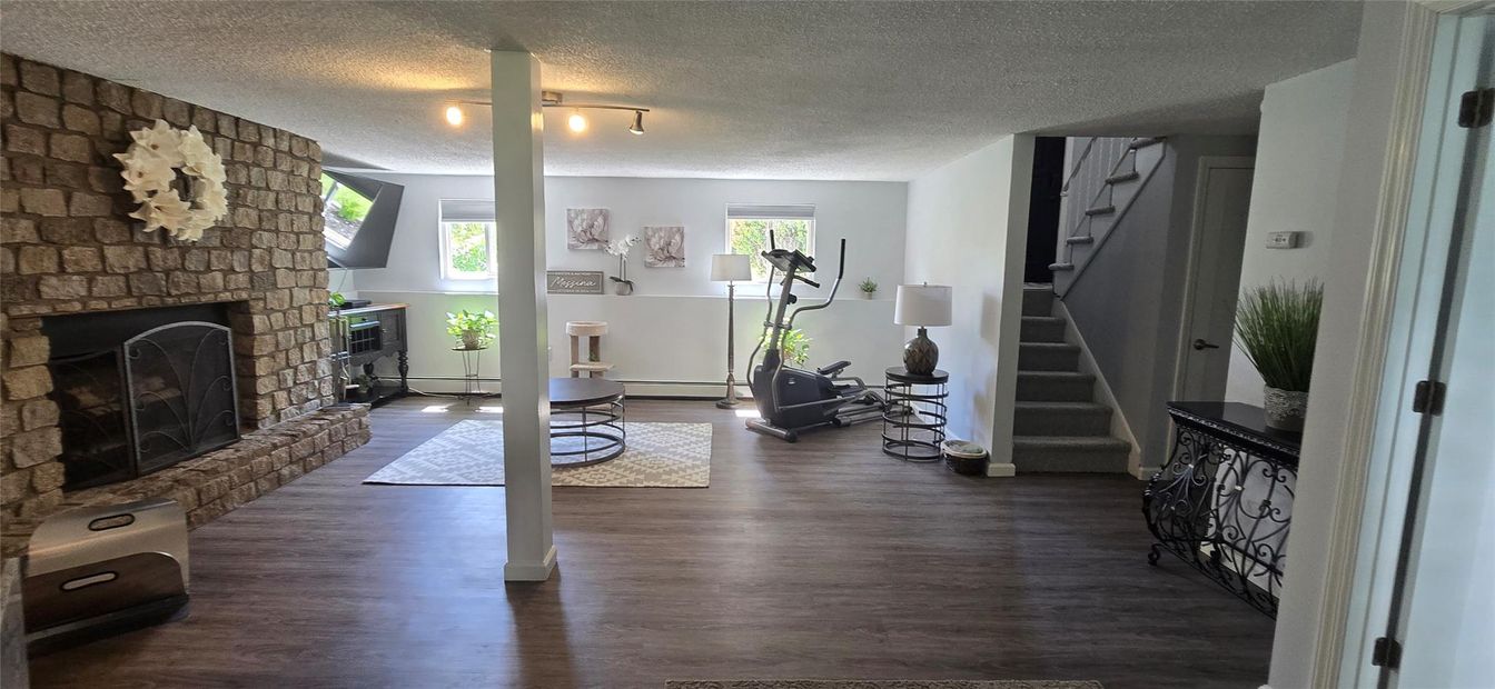 Fireplace, Fitness Equipment, Interior, Stone Walls, Wood Texture Flooring