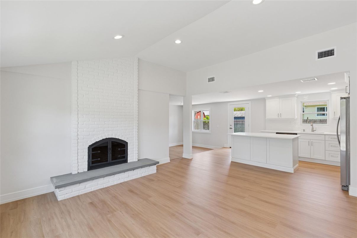 Empty room, Fireplace, Interior, Kitchen, Recessed Lighting, Wood Texture Flooring