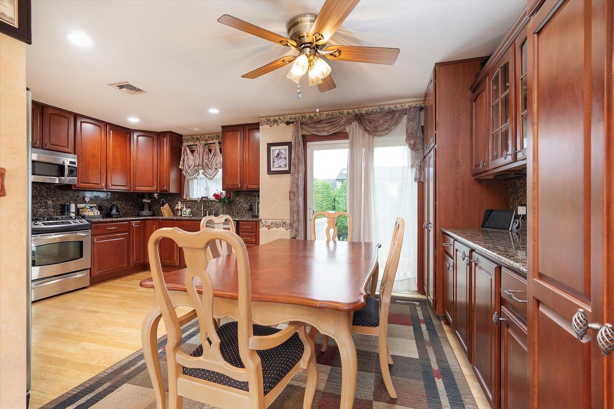 Dining room, Interior, Kitchen, Recessed Lighting, Stainless Steel Appliances, Wood Texture Flooring