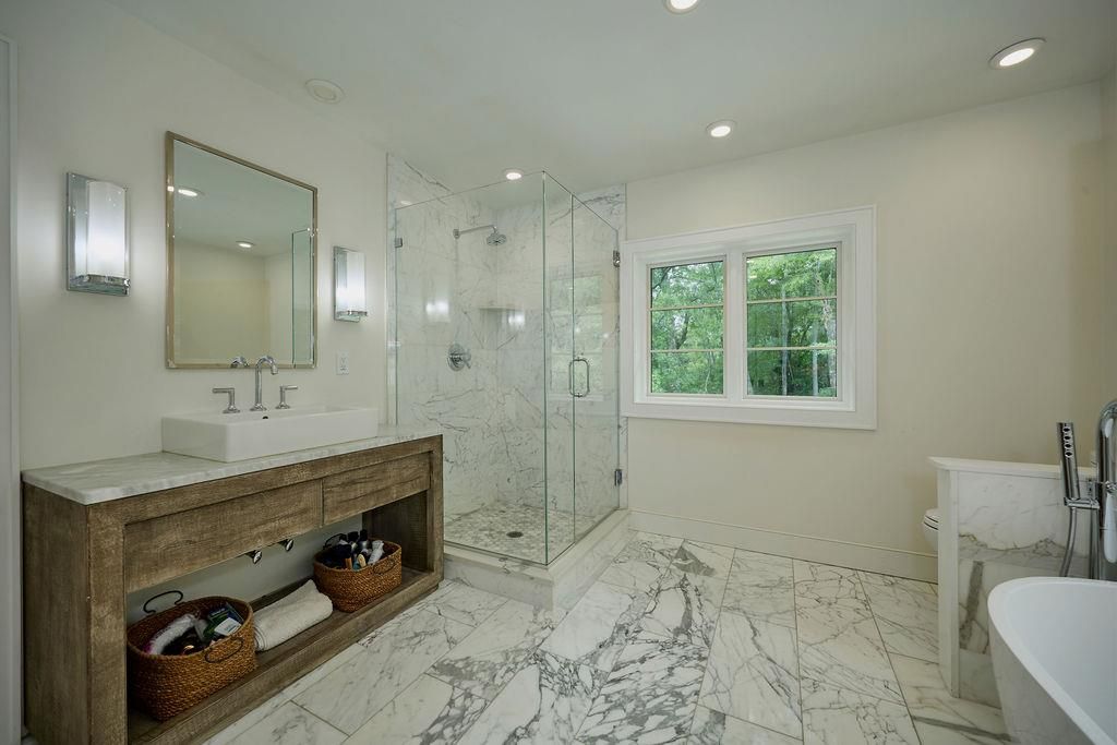 Bathroom, Dual Sink Vanities, Glass Shower, Interior, Marble, Marble Walls, Recessed Lighting