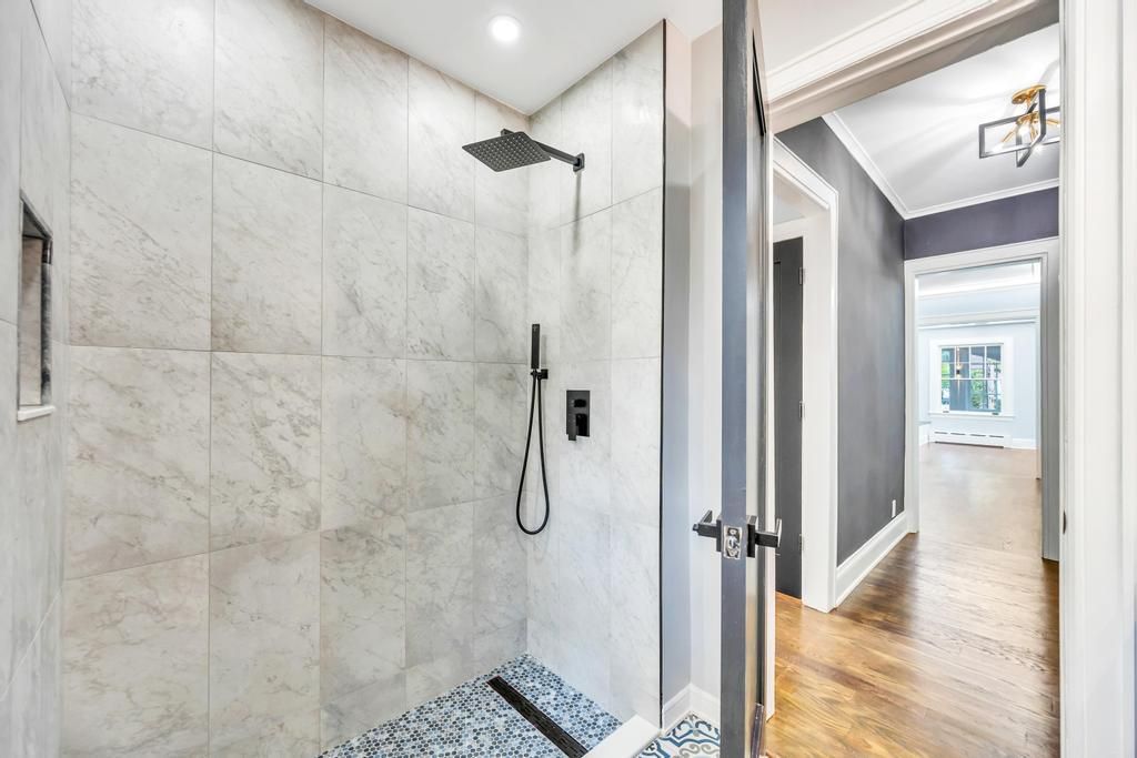 Bathroom, Glass Shower, Interior, Marble Walls, Recessed Lighting, Wood Texture Flooring