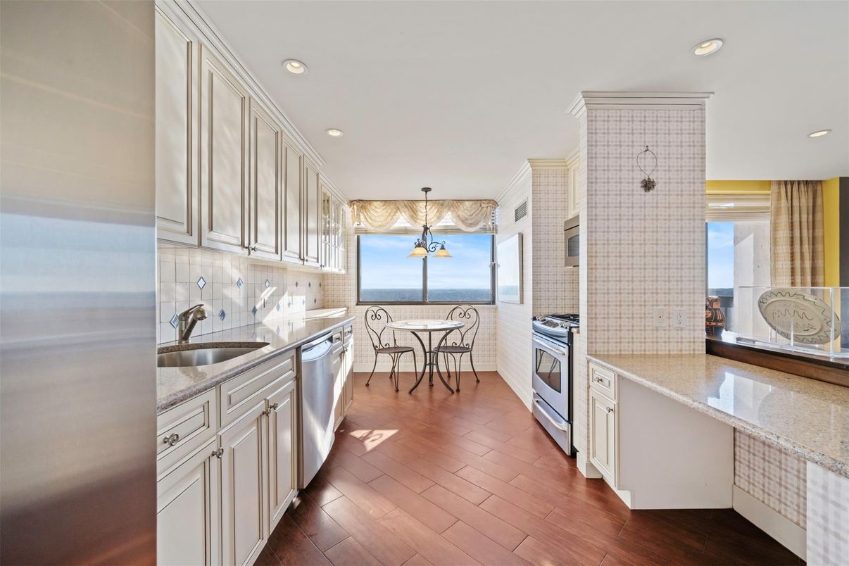 Dining room, Interior, Kitchen, Recessed Lighting, Stainless Steel Appliances, Water, Wood Texture Flooring