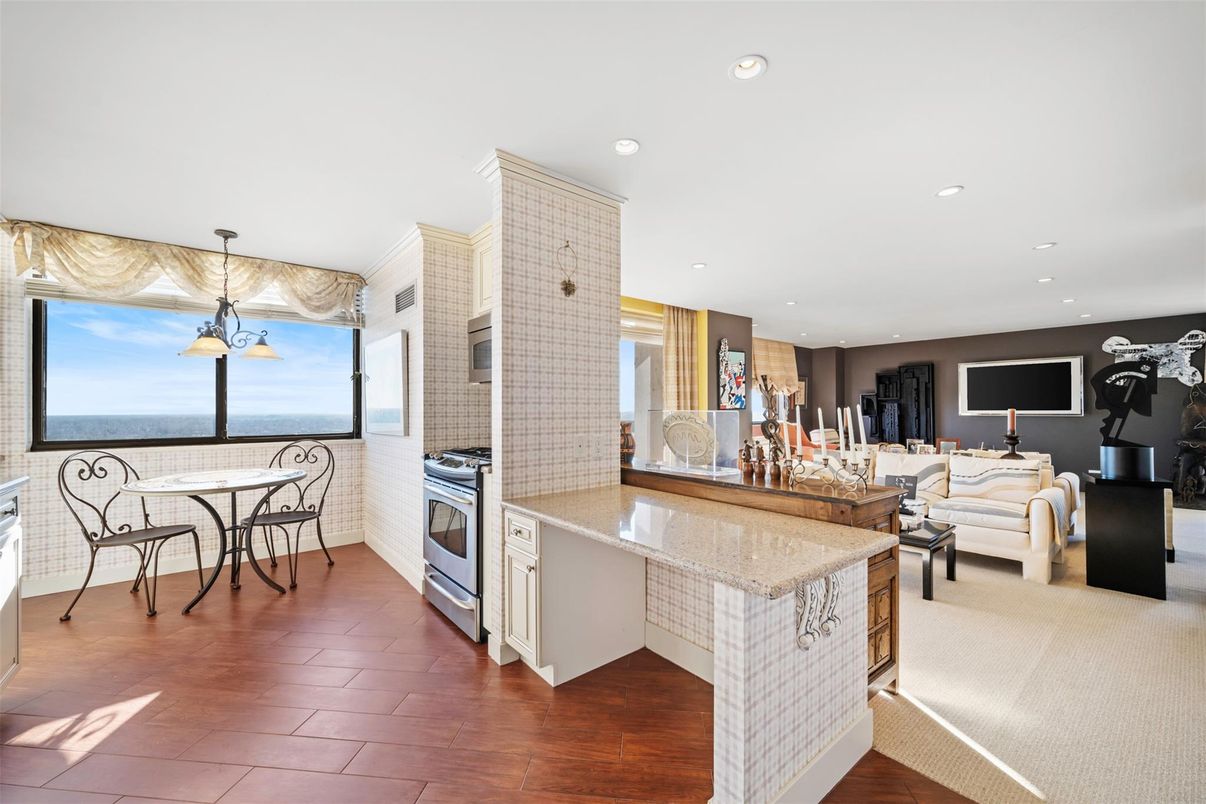 Dining room, Interior, Kitchen, Living room, Pendant Lights, Recessed Lighting, Stainless Steel Appliances, Water, Wood Texture Flooring