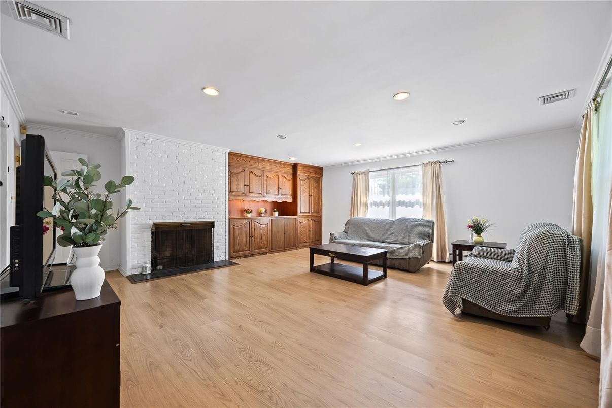 Fireplace, Interior, Living room, Recessed Lighting, Stone Walls, Wood Texture Flooring
