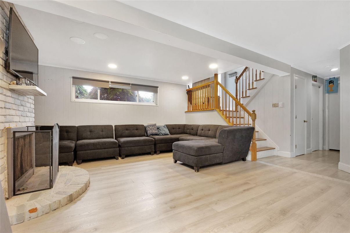 Fireplace, Interior, Living room, Recessed Lighting, Stone Walls, Wood Texture Flooring