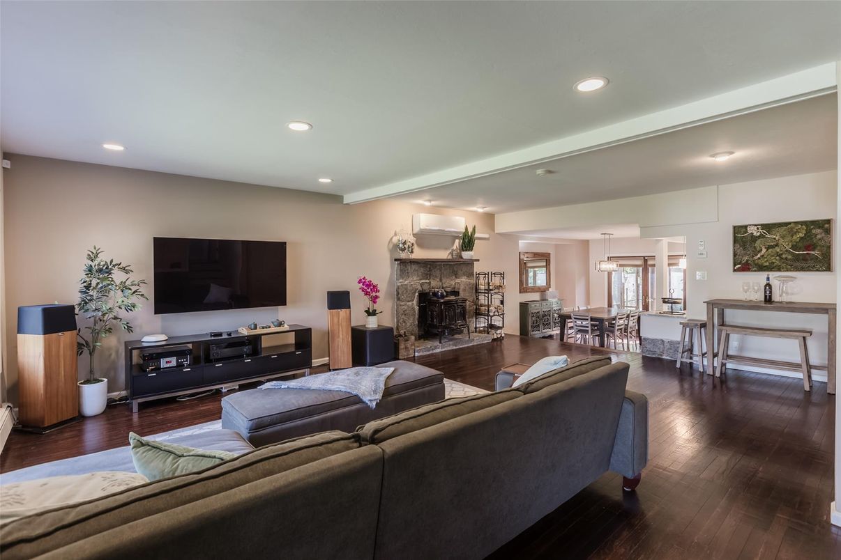 Dining room, Fireplace, Interior, Living room, Recessed Lighting, Wood Texture Flooring