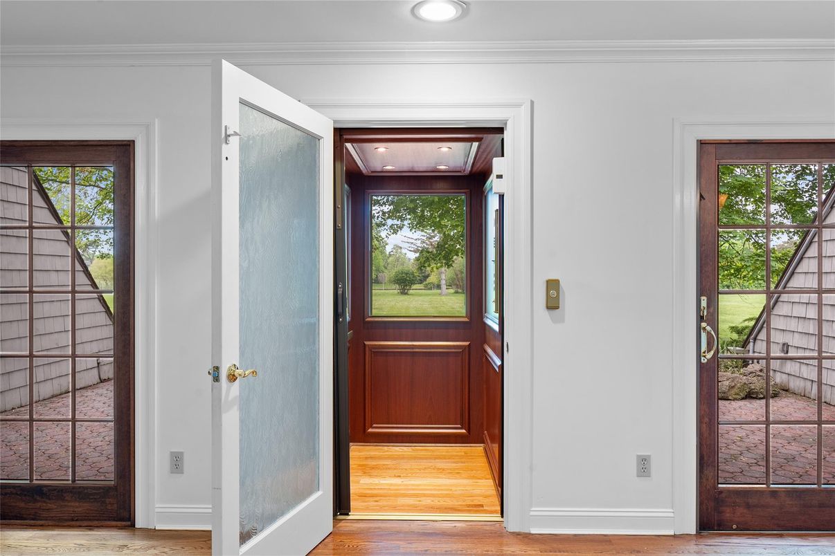 Elevator, Interior, Recessed Lighting, Wood Texture Flooring, Wooden Walls