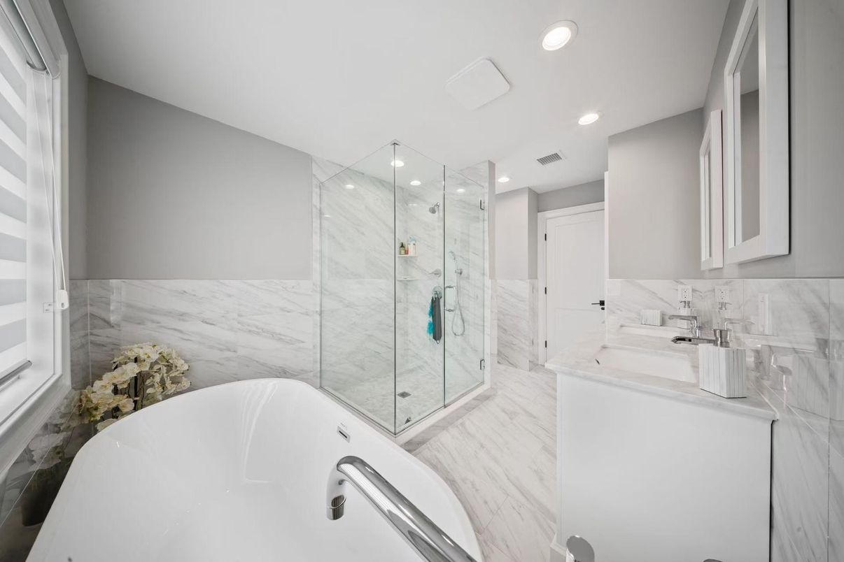 Bathroom, Dual Sink Vanities, Free Standing Baths, Glass Shower, Interior, Marble, Marble Walls, Recessed Lighting