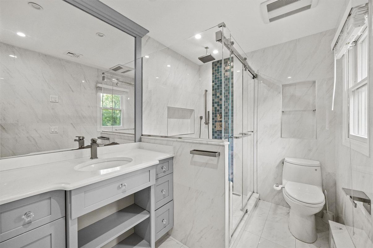 Bathroom, Dual Sink Vanities, Glass Shower, Interior, Marble, Marble Walls, Recessed Lighting