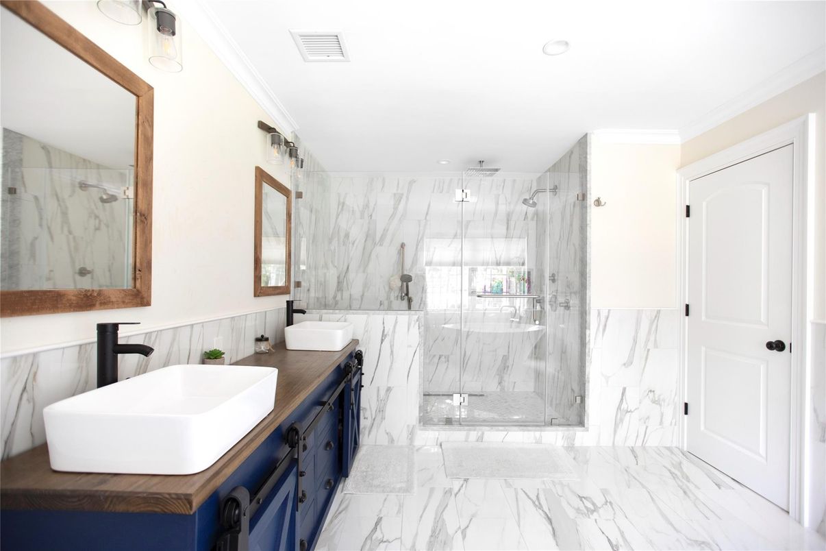 Bathroom, Dual Sink Vanities, Glass Shower, Interior, Marble, Marble Walls, Recessed Lighting