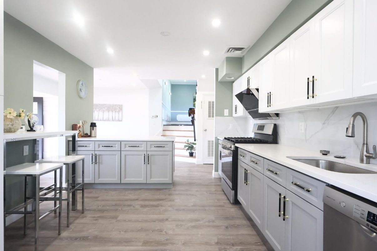 Interior, Kitchen, Marble Walls, Recessed Lighting, Stainless Steel Appliances, Wood Texture Flooring
