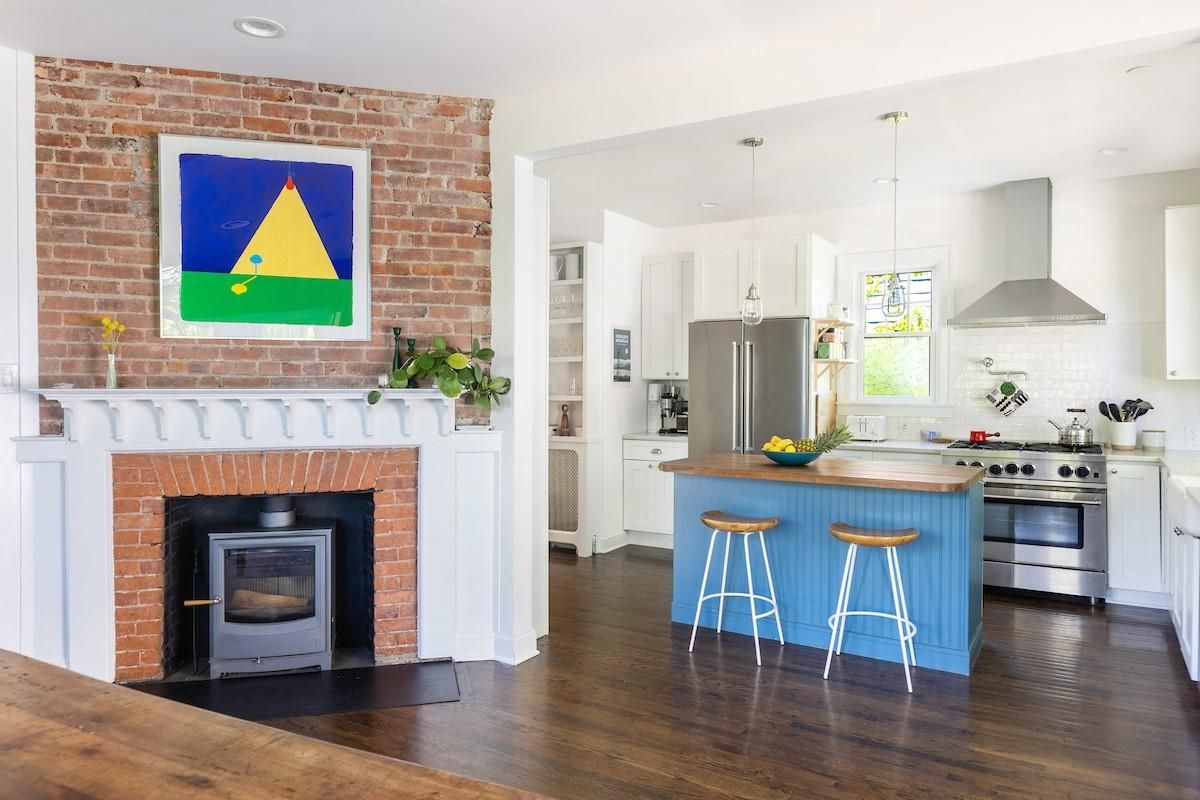 Fireplace, Interior, Kitchen, Pendant Lights, Recessed Lighting, Stainless Steel Appliances, Stone Walls, Wood Texture Flooring