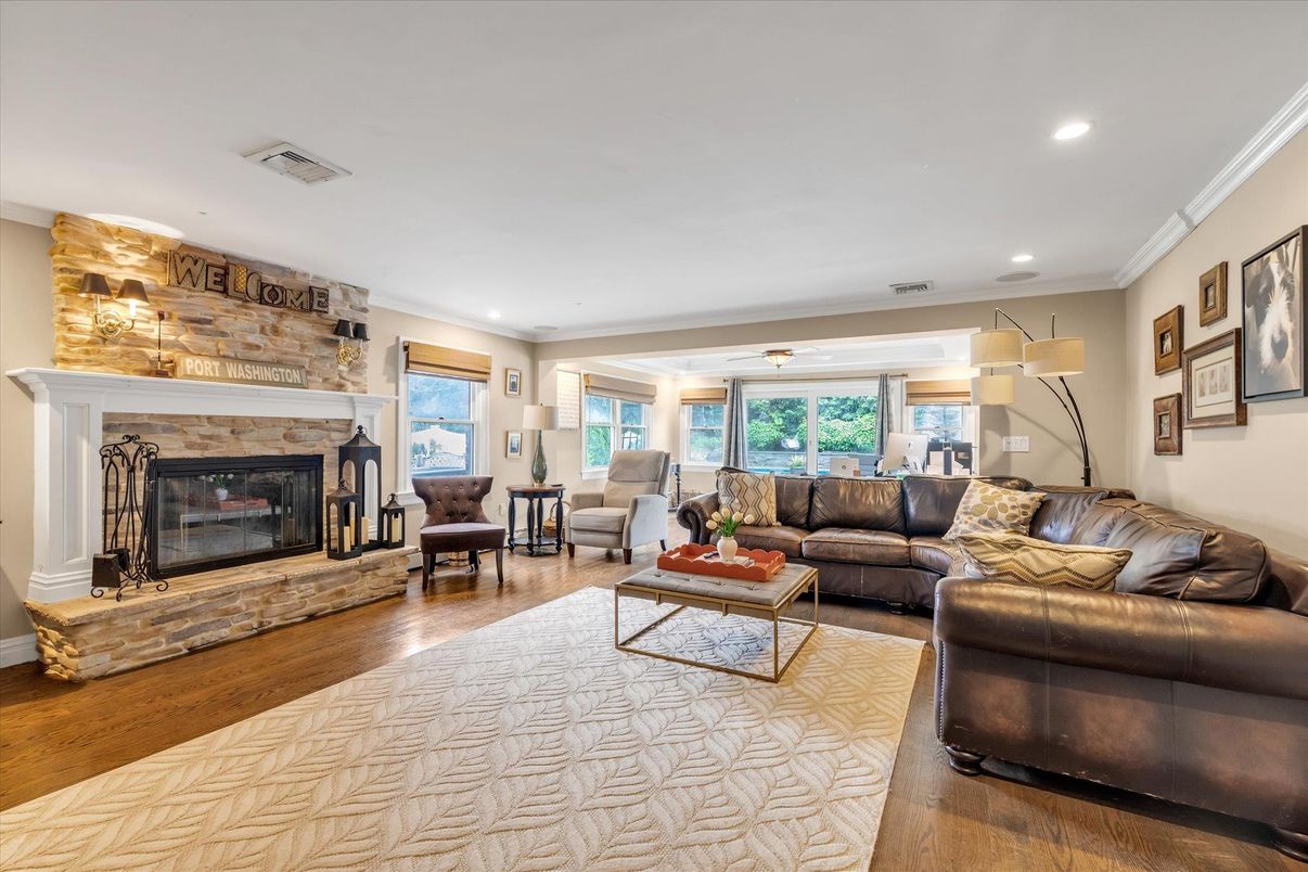 Fireplace, Interior, Living room, Recessed Lighting, Stone Walls, Wood Texture Flooring