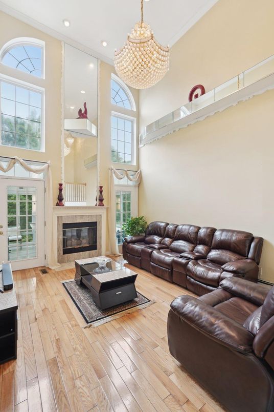 Chandelier, Fireplace, Interior, Living room, Recessed Lighting, Wood Texture Flooring