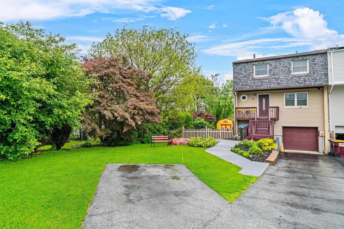 Attached, Backyard, Exterior, Facade, Brick Facade, Raised Ranch