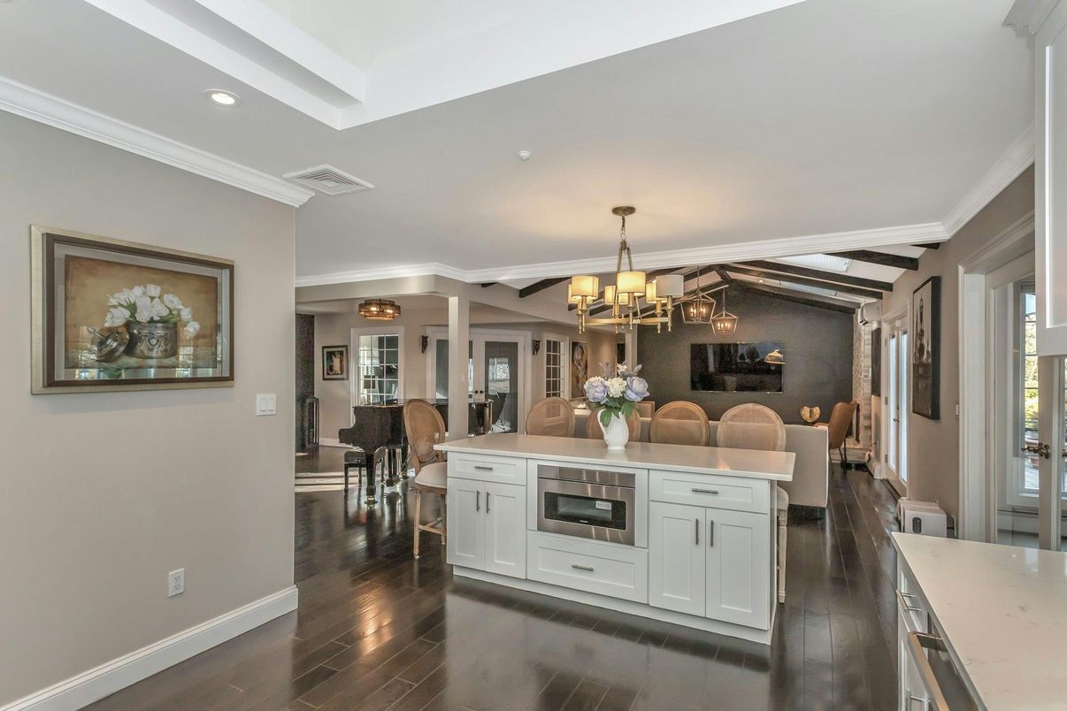 Chandelier, Dining room, Interior, Kitchen, Recessed Lighting, Stainless Steel Appliances, Wooden Beams, Wood Texture Flooring