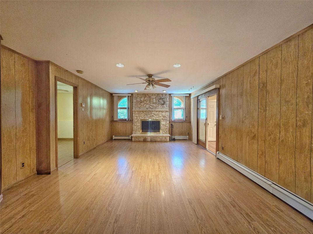 Empty room, Fireplace, Interior, Recessed Lighting, Wood Texture Flooring, Wooden Walls