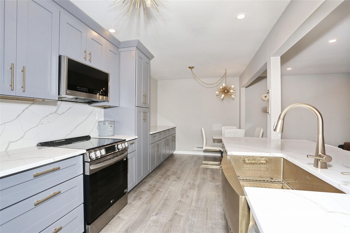 Chandelier, Dining room, Interior, Kitchen, Recessed Lighting, Stainless Steel Appliances, Wood Texture Flooring